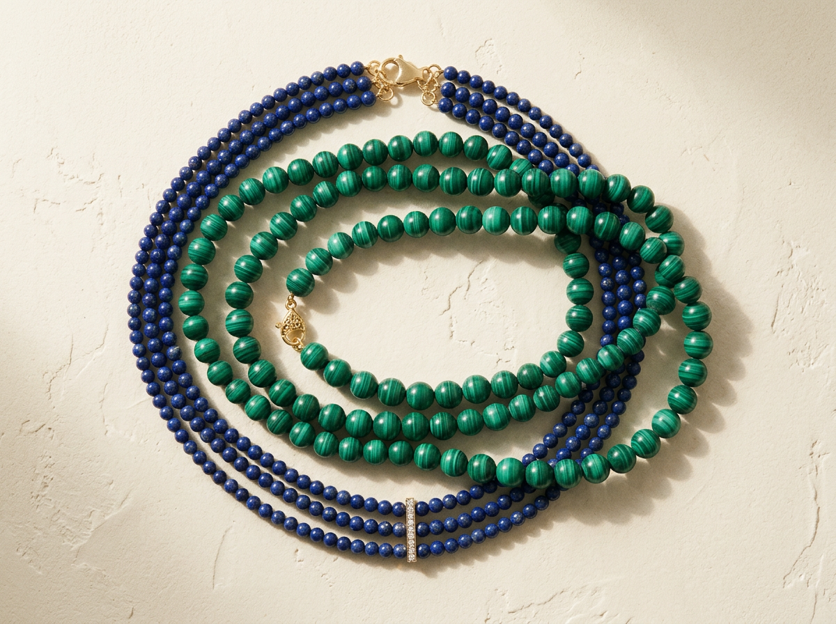 Malachite and lapis strands coiled together on ivory plaster